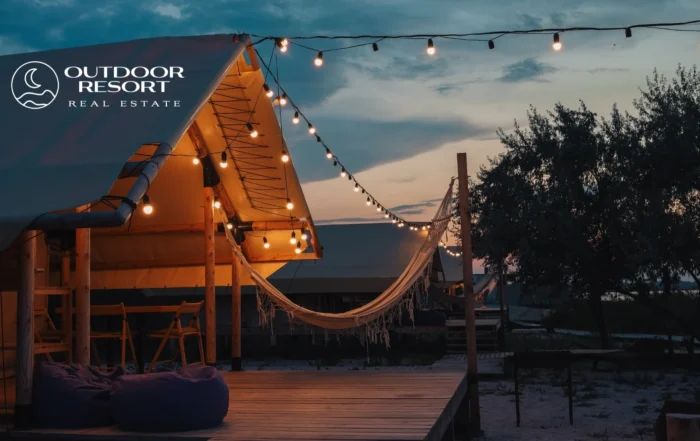 Top Outdoor Resort Markets 2026 - Outdoor Resort Real Estate glamping tent with string lights at sunset.